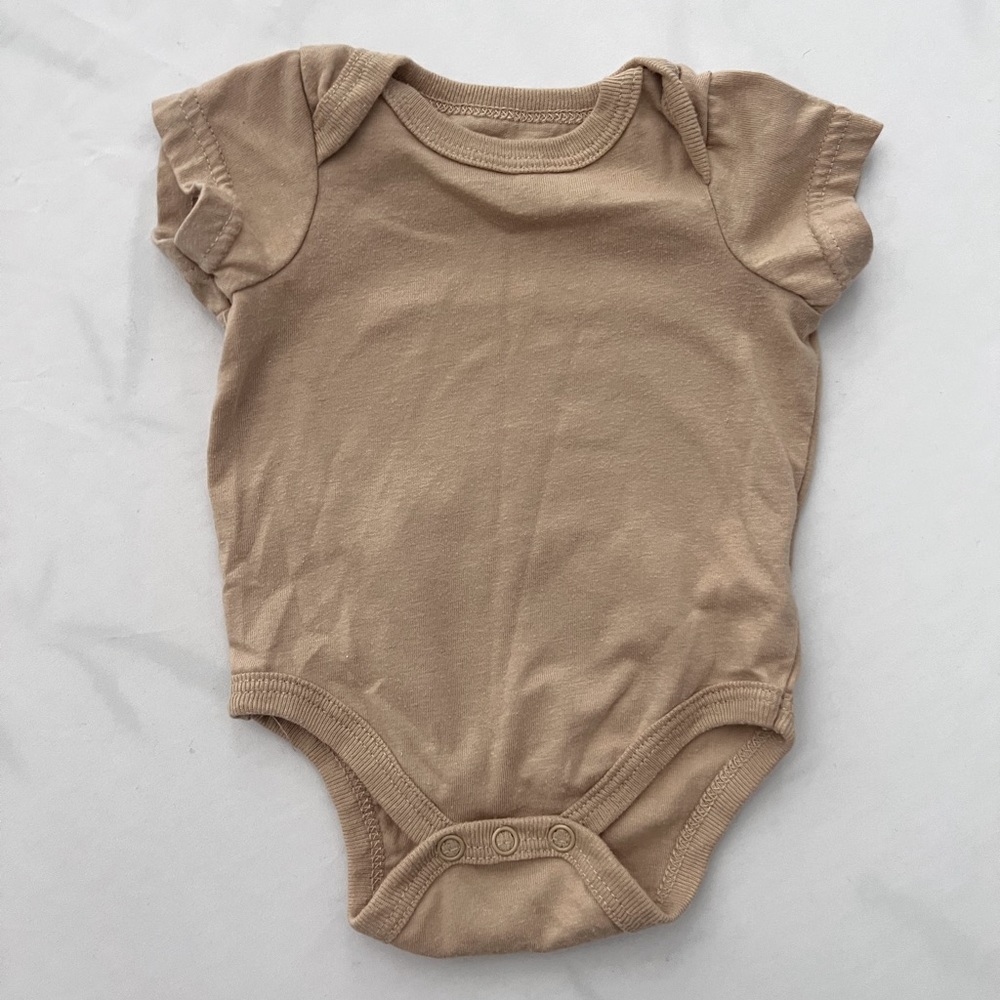 Tan NB onesie slightly worn